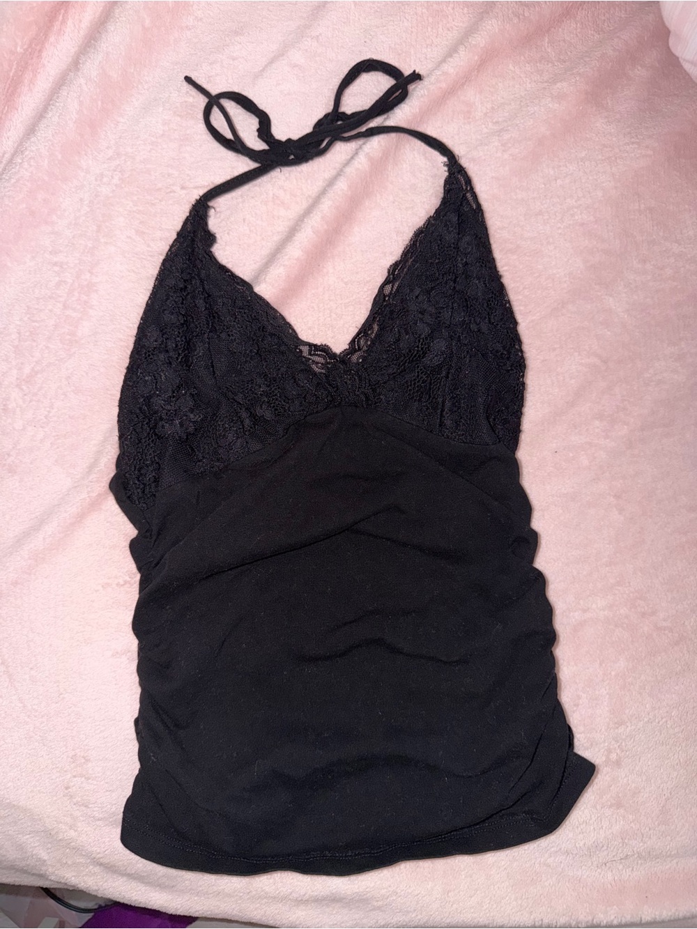 Black lace halter top with tie back detail.